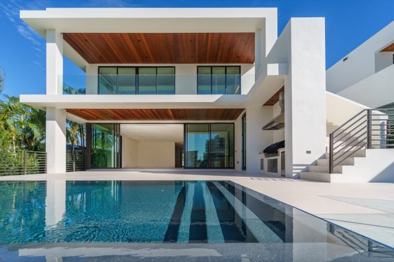 A very modern mansion with an infinity edge pool and wood clad decks. 